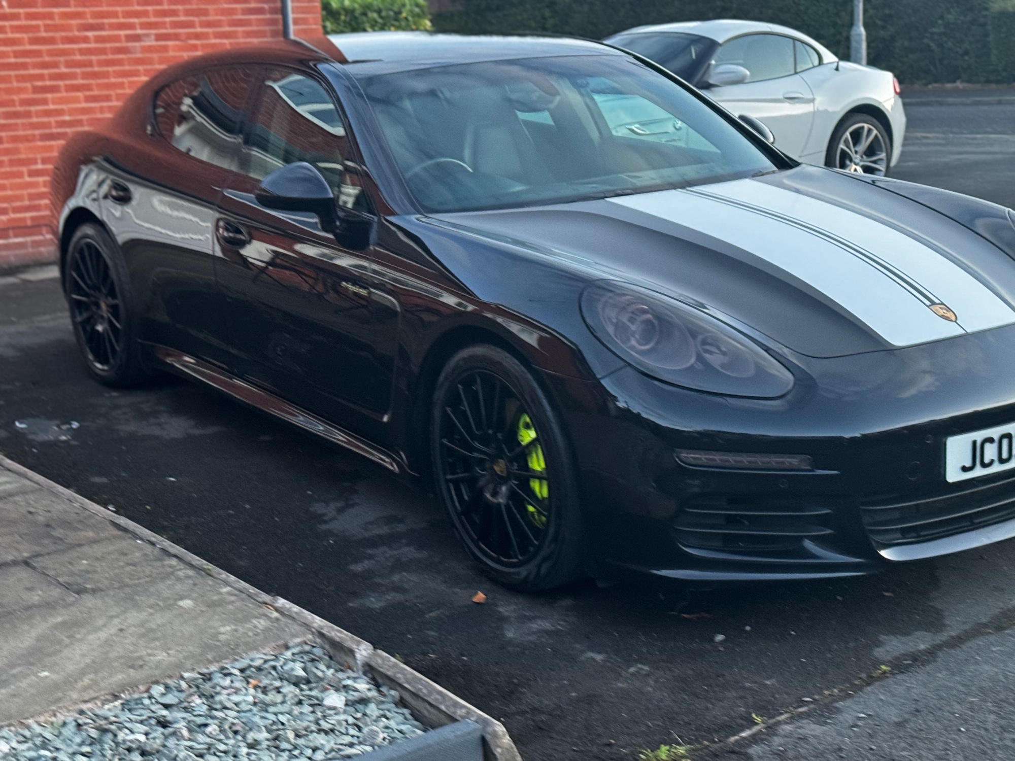 Jamie's black Porsche with silver stripes and bright green brake callipers